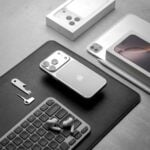 Apple iphones and accessories arranged on a surface.