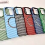 a group of four cell phones sitting on top of a table