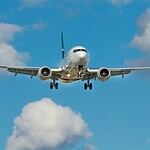 white airplane on mid air