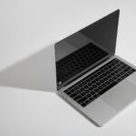 macbook pro on white table