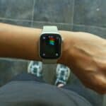 A wrist with an apple watch.