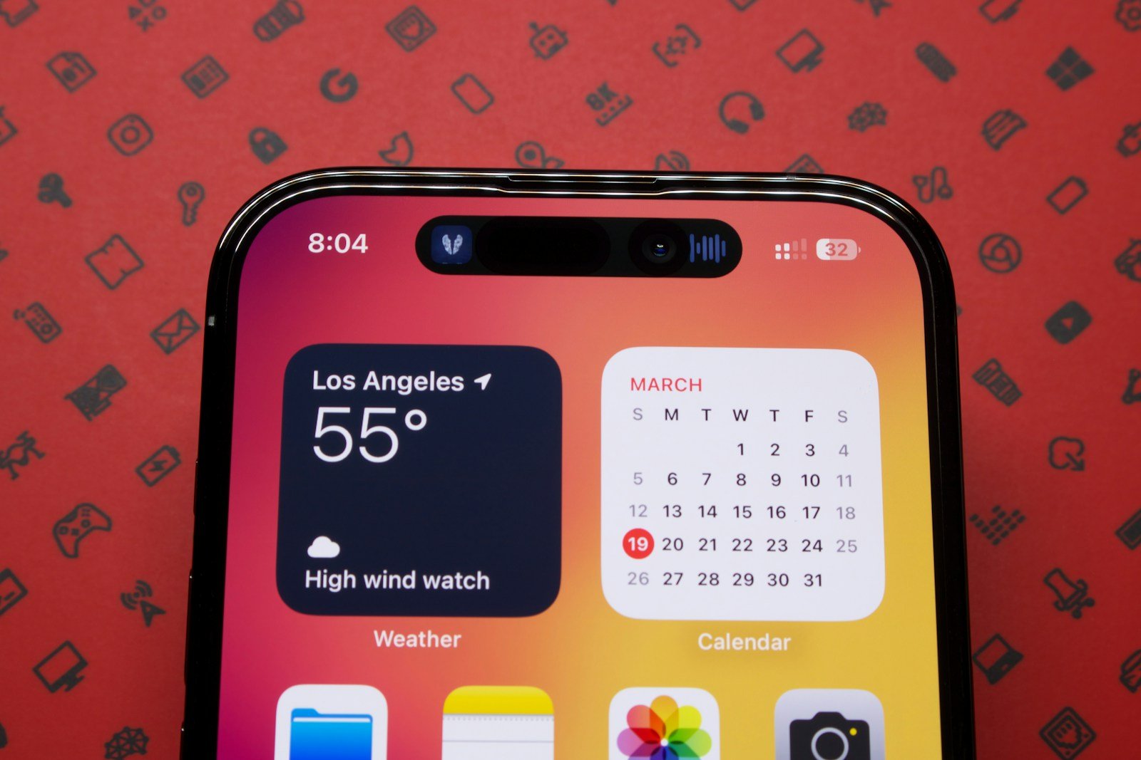 a close up of a cell phone with a calendar on the screen
