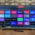 Smart TV screen displaying various application icons.