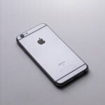 silver iphone 6 on white table