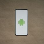 a cell phone with a green icon on it