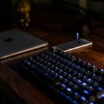black computer keyboard on brown desk