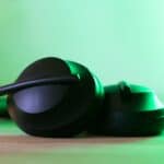 black and green headphones on green surface