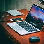MacBook Pro on brown wooden surface