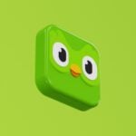 a green square object with eyes and a nose