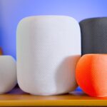 a close up of three different speakers on a table