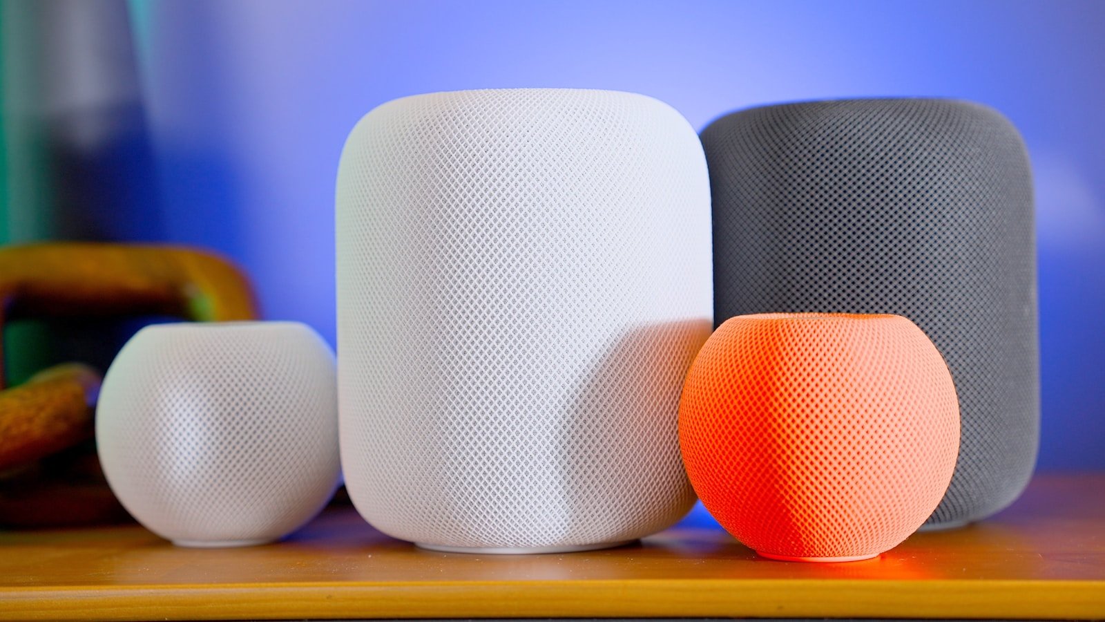 a close up of three different speakers on a table