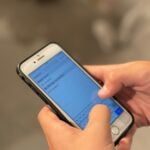 person holding silver iphone 6