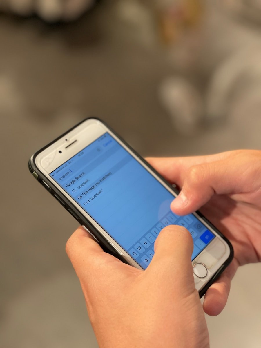 person holding silver iphone 6