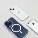 see history in iphone safari three cell phones sitting next to each other on a table