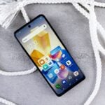 a close up of a cell phone on a rope