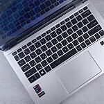 an open laptop computer sitting on top of a table