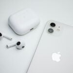 an apple product with ear buds and an iphone