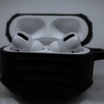 white apple earpods in black case