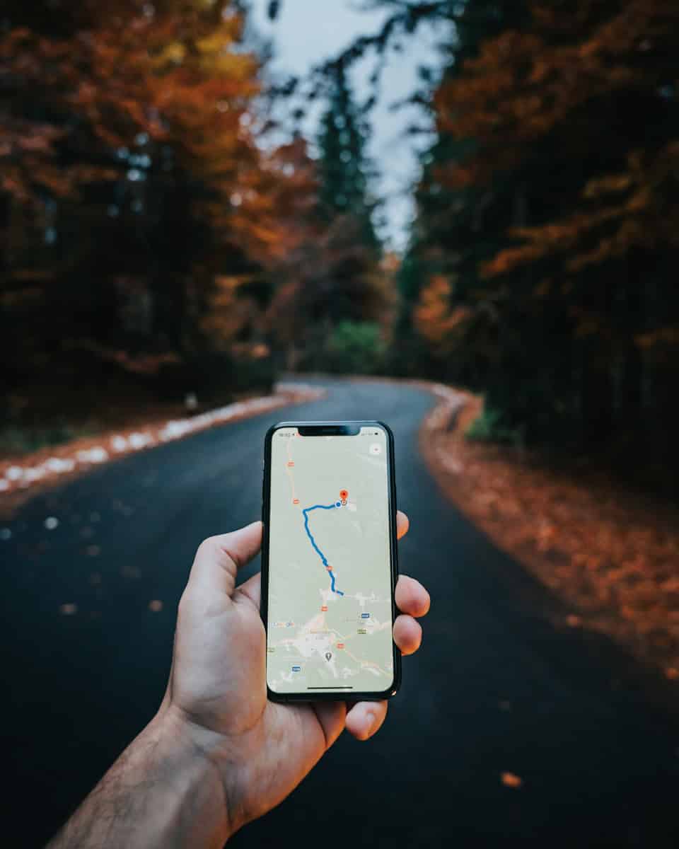 person holding white iphone