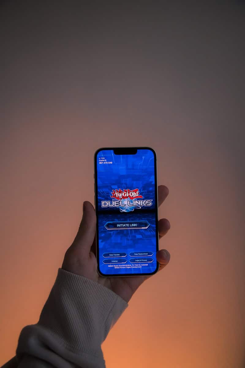 a person holding a cell phone in their hand