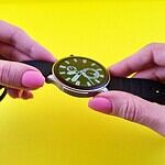 a person holding a stopwatch