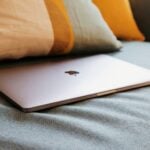 macbook air on gray textile