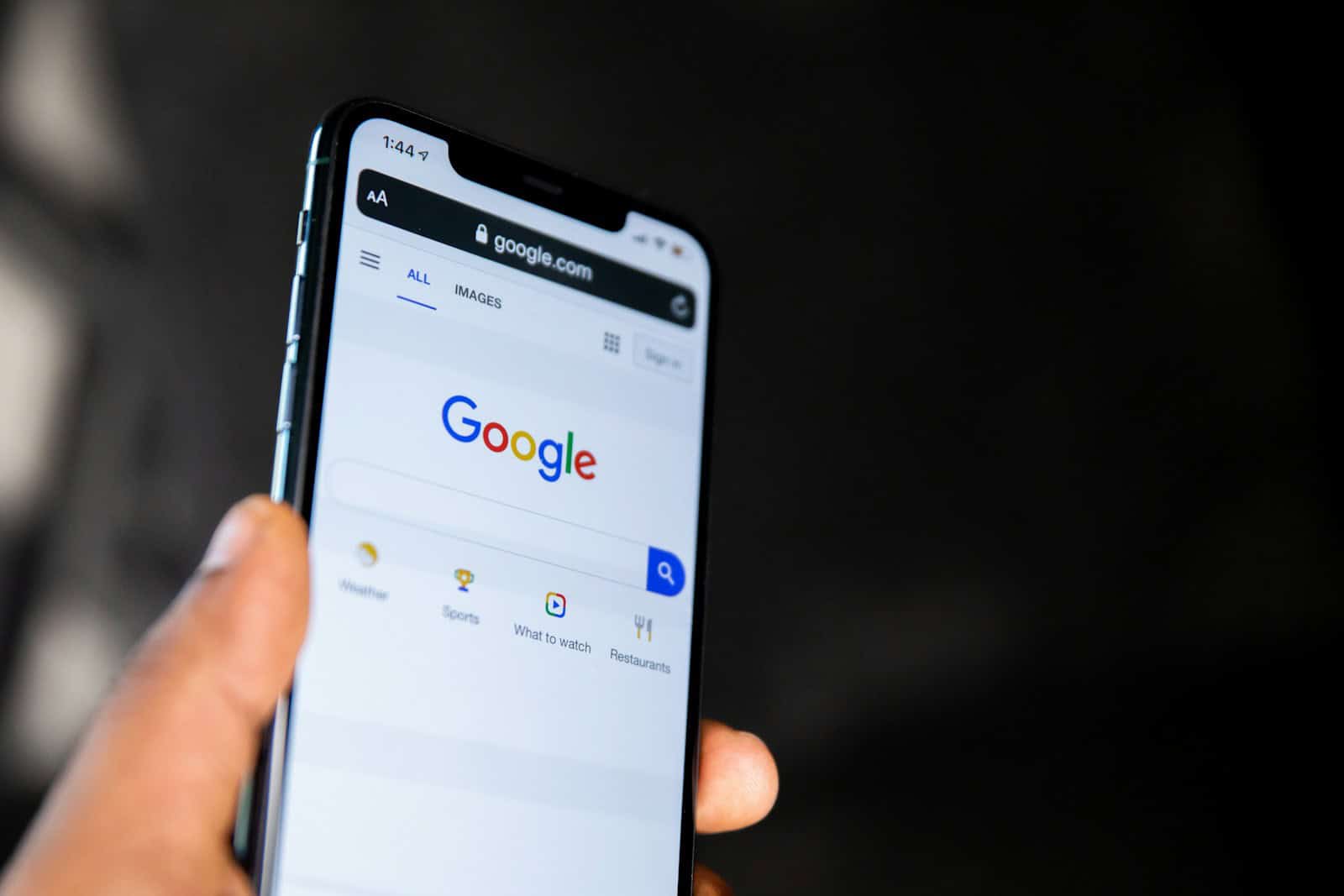 person holding black smartphone