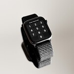 an apple watch with a bunch of metal bands