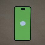 a green iphone case with a white speech bubble on it