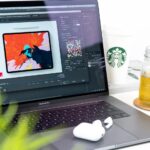 turned on MacBook Pro displaying music