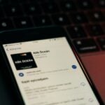 black android smartphone on macbook pro
